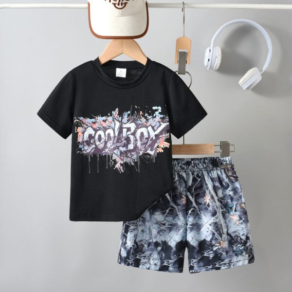 Boys&apos; urban street style outfit trend with colorful ink graffiti T-shirt + camouflage shorts set